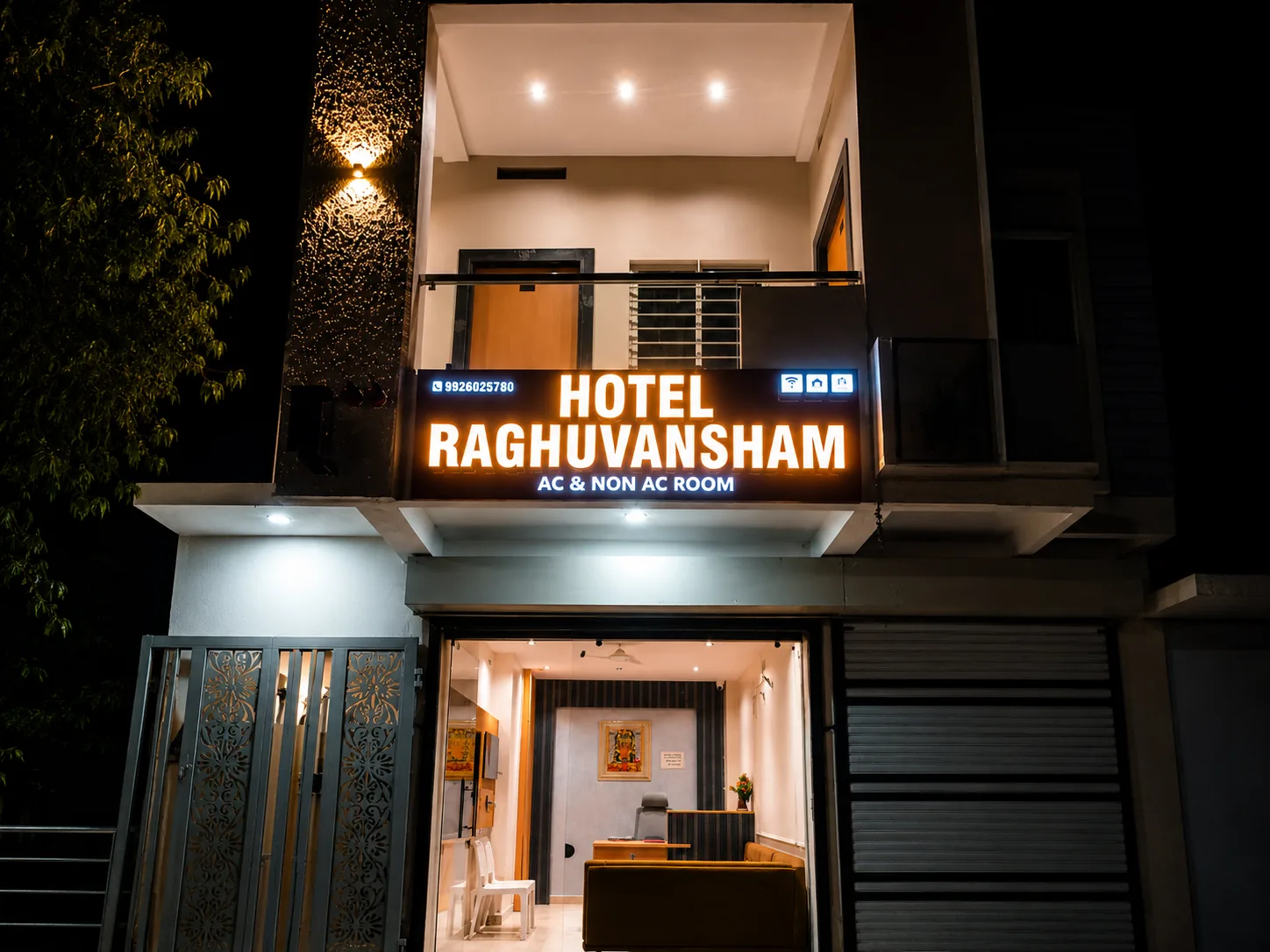 Hotel Raghuvansham illuminated entrance at night